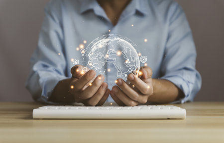 Businessman showing a globe with an icon. Big Data Digital Link Technology Internet connection application online. Concept of marketing business. Finance and Banking. global successの写真素材