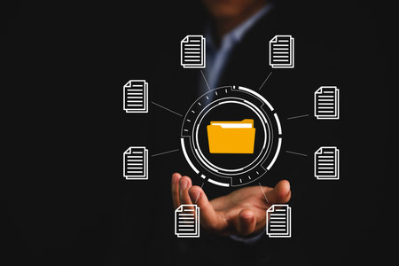 Businessman hand showing electronic document management icon. Concept of efficient access to a...