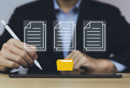 business people use tablet to manage electronic documents The concept of efficient access to an online corporate business document database. Internet file system Digital technology paperless officeの写真素材