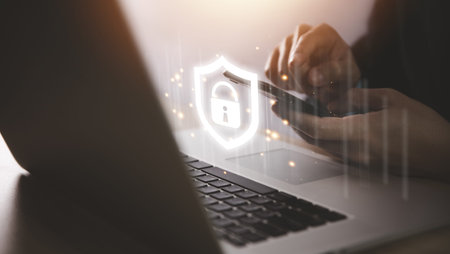 Businessman holding a shield icon with a lock mark. computer data password protection concept...