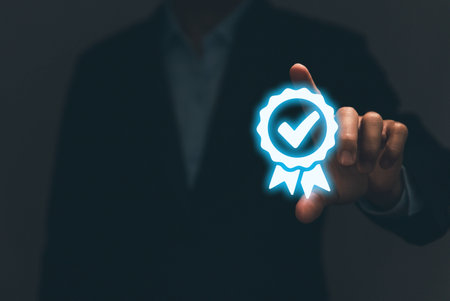 Businessman hand showing digital technology icon sign with a check mark. The best quality assurance service concept. Product performance assurance and industry-leading ISO certificationの写真素材