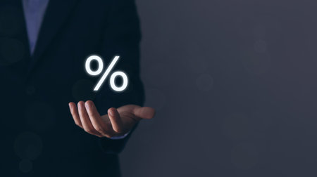 Businessman hands showing percentage symbol icon. The concept of investing in the business of increasing profits of stocks. Finance, marketing, sales, interest rates Better economy, and discountsの写真素材