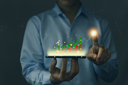 businessman using a tablet to plan a strategy that shows a positive digital technology graph chart....