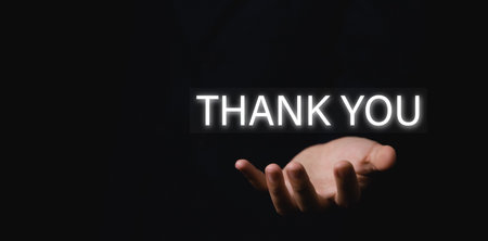 The businessman's hand shows the message. Words thank you. Letter writing concept. congratulation, appreciation, and gratitude. with Copy Spaceの写真素材