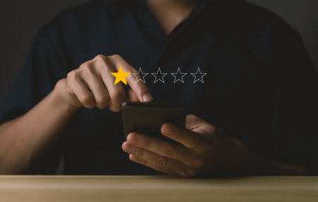 Customer Review Experience Dissatisfied Selection of 1-star rating reviews on smartphone screens. negative feedback concept Unhappy businessman, poor service, or poor quality.の写真素材