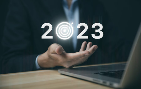 Businessman hand showing 2023. Investment startup concept. Implementation of the 2023 New Year's...