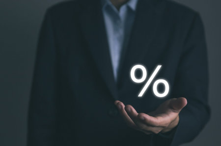 Businessman hands showing percentage symbol icon. The concept of investing in the business of increasing profits of stocks. Finance, marketing, sales, interest rates Better economy, and discountsの写真素材