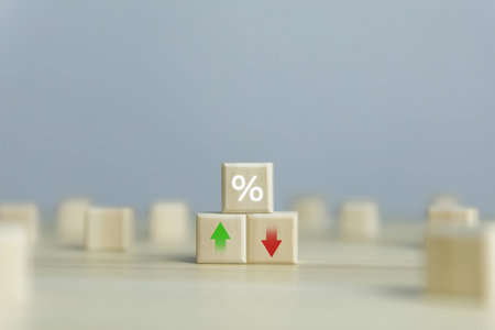 Wooden cube blocks with percentage icons and up or down arrows. business concept finance economy mortgage Bank interest rates, loans, investments, stock growth, and dividends.の写真素材