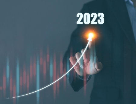 Businessman planning digital stock market analysis strategy showing positive technology chart...