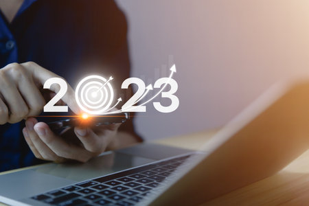 Businessman hand showing 2023. Investment startup concept. Implementation of the 2023 New Year's goals and strategies, developing business growth for future success financial change managementの写真素材