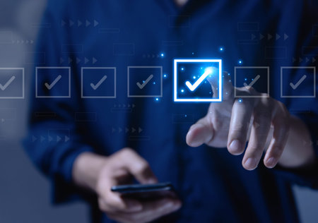 Businessman ticking checkmark on a box in the list Show on the virtual screen. Checklist Ideas in...