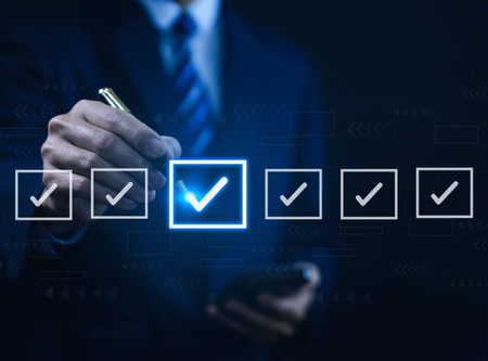 Businessman ticking checkmark on a box in the list Show on the virtual screen. Checklist Ideas in Business Survey items and questionnaires. copy spaceの写真素材