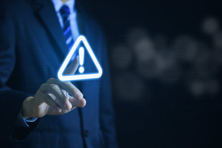 Businessman touch warning triangle and exclamation sign icon Warning of dangerous problems Server error. Virus. Maintenance concept. caution internet technology network securityの写真素材