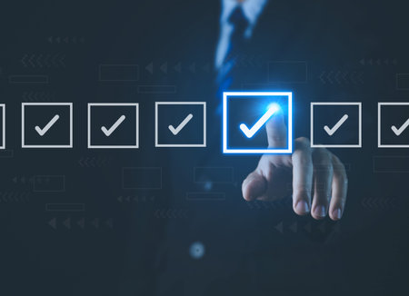 Businessman ticking checkmark on a box in the list Show on the virtual screen. Checklist Ideas in...