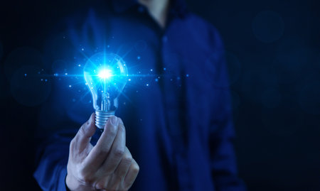 businessman holding a light bulb Digital technology. imagine an idea Creative and innovative. brain to brainstorm ideas in business. Strategies for development, growth, and successの写真素材