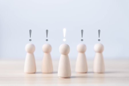 wooden block people show an exclamation mark. business development ideas Error warning, notification, maintenance, and finding solutions. with copy spaceの写真素材