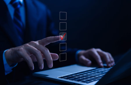 Businessman ticking checkmark on a box in the list Show on the virtual screen. Checklist Ideas in...