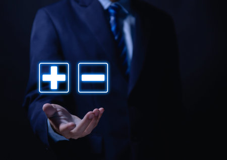 hand show plus and minus signs. Concept of opposites, decisions, and uncertainty. Positive or Negative Business Choices Analysis of advantages and disadvantages Comparisonの写真素材