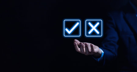 Businessman hand showing right and wrong symbol The idea is to decide to vote. Think yes or no decisions, and business options for difficult situations. true and false symbols agreeingの写真素材