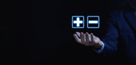 hand show plus and minus signs. Concept of opposites, decisions, and uncertainty. Positive or Negative Business Choices Analysis of advantages and disadvantages Comparisonの写真素材
