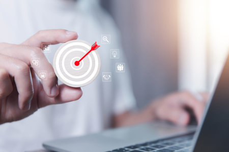 Businessman showing target arrow virtual digital technology icon on board, business investment...