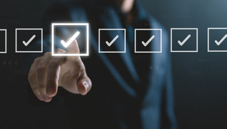 Businessman ticking checkmark on a box in the list Show on the virtual screen. Checklist Ideas in Business Survey items and questionnaires. copy spaceの写真素材