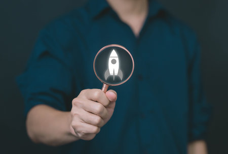 The hand shows a rocket. Concept of Startup Business, Entrepreneurship Idea, and Online Digital...
