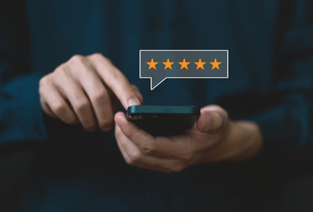 positive customer reviews Touching the smartphone shows five stars. satisfaction survey concept opinion customer serviceの写真素材