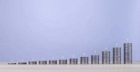 stacked coins up arrow and increase growth graph business development concept Stock market investment profits and strategies for making plans for success.の写真素材