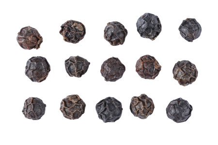 top view close up Heap of black pepper seeds. Spice. Isolated on white background.の写真素材