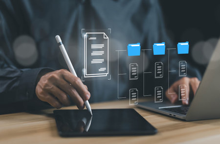 businessman manages data document electronic files digital on a laptop. concept Enterprise Resource Planning system or ERP is software for management recorded in a Database. business paperlessの写真素材