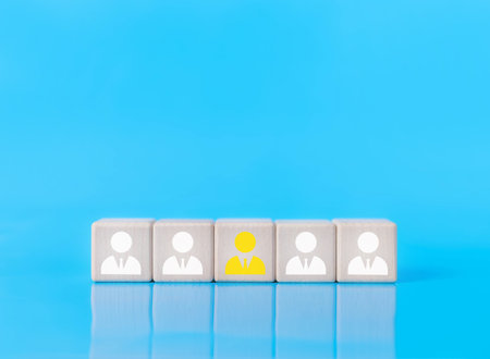 wood block shows an icon human. concept of human resource manager, HR, company service to recruit customers, network links worldwide, hiring, and recruitment processes manage people and businessの写真素材