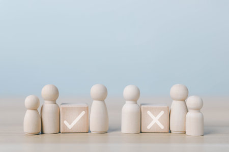 wood block people showing check right and wrong. concept decide to choose vote. yes or no decisions, and business options for difficult situations in dilemma. true and false symbols agreeingの写真素材