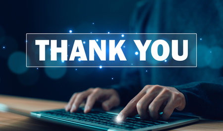 businessman using a laptop and showing the message thank you on a display screen. concept of thank you business, appreciation and gratitude, congratulations, presentation from technology digitalの写真素材