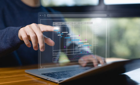 project planner in software, updating and managing milestones on a timeline Gantt chart in technology online. schedule plan management work update and workflow. concept appointment staff of businessの写真素材