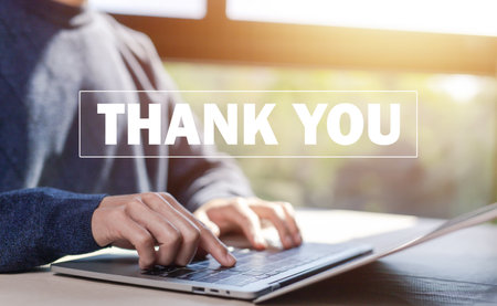 message thank you on a laptop. concept of thank you business, appreciation and gratitude, congratulations, presentation from technology digitalの写真素材