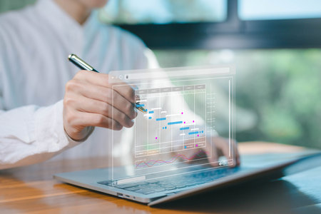 updating and managing milestones on a timeline Gantt chart in technology online. concept project...