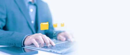 enterprise resource planning system, ERP concept. manages document data on a laptop. document files...