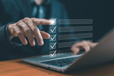 task audit in a list of documents, tick the checkmark in the survey item on a laptop. tick mark...