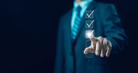 tick the checkmark in the survey item on a laptop. checklist concept, detail business verify task. process order, task audit in a list of documents. tick mark evaluation in options check form onlineの写真素材