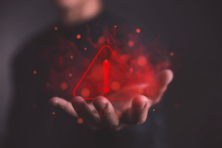 The hand shows a warning sign error 404 on the website with red smoke. alert cyber attack, symbol...