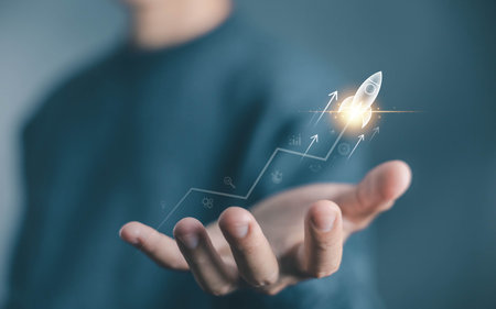 businessman launch rocket, startup concept. entrepreneurship starts with digital technology and the...