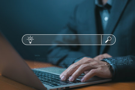 AI search engine concept. businessman typing on laptop, symbolizing artificial intelligence, innovation, data technology for smart business solutions and digital transformation. search ai assistantの写真素材