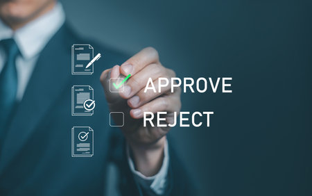 Business approval and decision concept with hand selecting the approve option on digital document interface, symbolizing contract validation, authorization, workflow efficiency, and corporate process.の写真素材