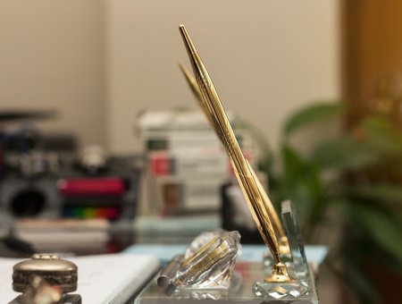 Gold plated ink pen on table at law officeの写真素材