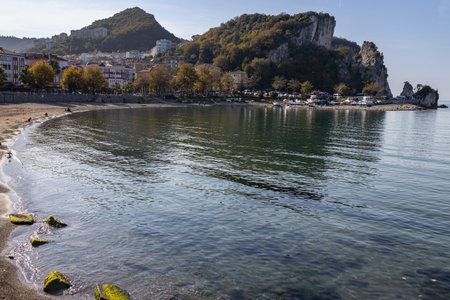 Calm coastal scenes from Amasra, Turkey, featuring clear blue water, rocky cliffs, and a peaceful shoreline under bright daylight.の写真素材