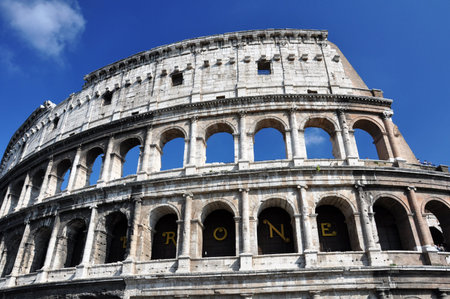 Photo of the Colosseum in Rome, Italy, with beautiful sky and a clear weather の写真素材