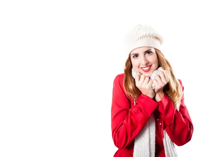 Cute redhead looking at camera with white scarft and white hatの写真素材