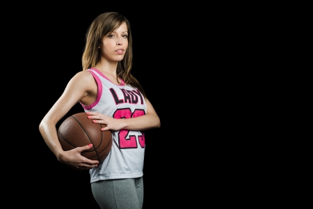 Blonde with basket ball looking to cameraの写真素材