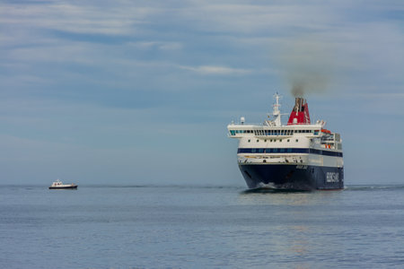 Denia, Alicante, Spain, november 21, 2018: A Greek ferry entering the harbor next to boatのeditorial素材